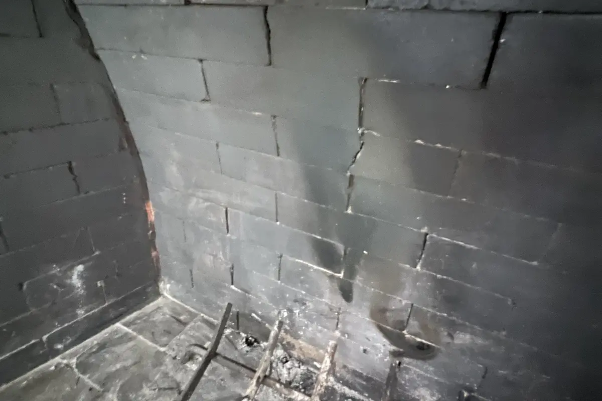 Clean firebox interior after professional chimney sweep service