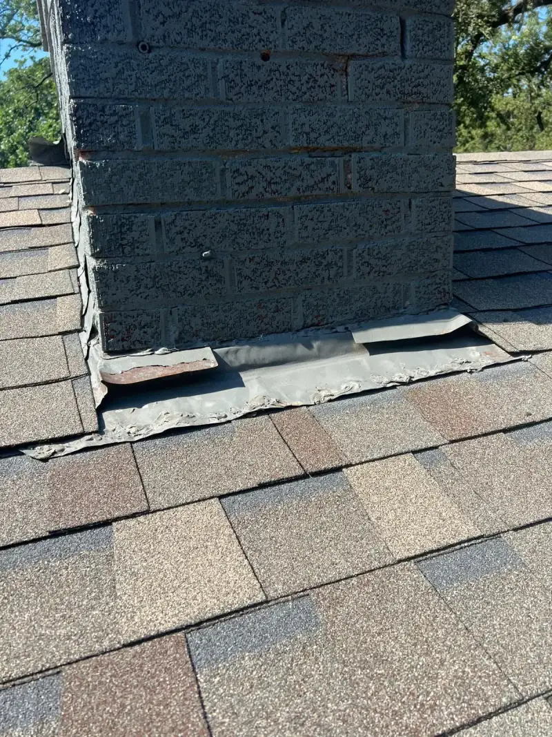 Chimney interior during professional sweep - soot removal in progress