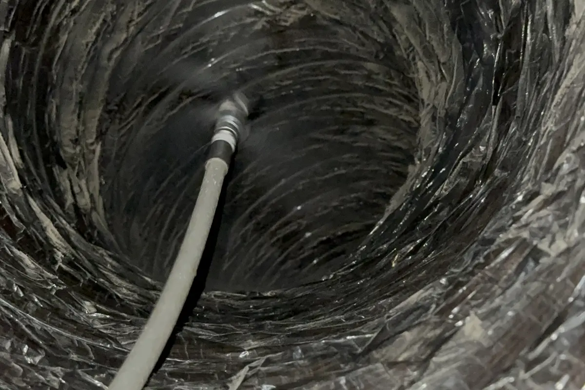 Rotary cleaning whip working inside residential flex ductwork