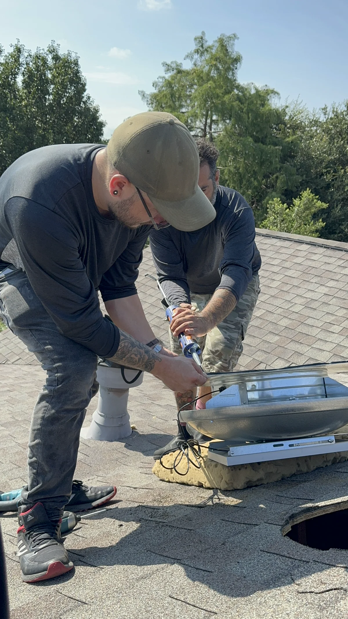 Solar attic fan installed on residential roof in Austin - powered by direct sunlight