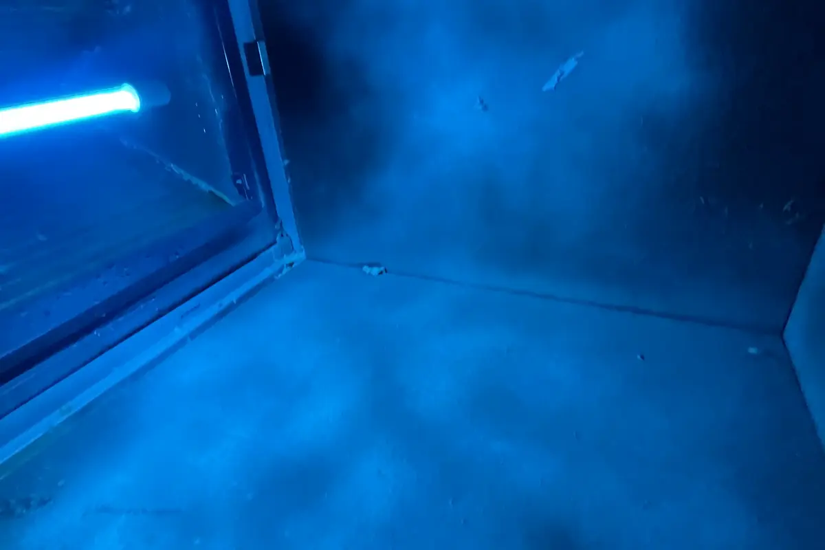 UV-C bulb glowing inside air handler killing bacteria and allergens